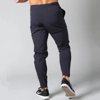 Czarne biegacze spodnie mężczyźni biegowe spodnie szybkoschnące spodnie sportowe siłownia fitness sportowe spodnie męskie letnie cienkie treningowe dna