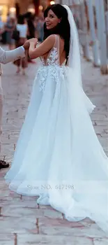 Przezroczyste ramiączka-spaghetti Sexy A-line eleganckie suknie ślubne z odkrytymi plecami szatach mariee de robe de mariages suknia ślubna tiul